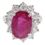 18ct white gold oval ruby and round brilliant cut diamond cluster ring