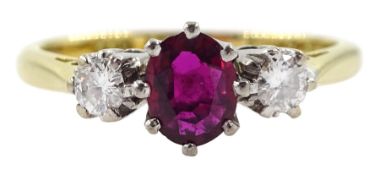 Gold three stone oval ruby and diamond ring