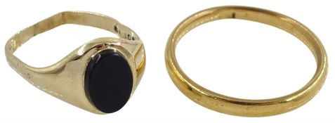 22ct gold wedding band and a 9ct gold black onyx signet ring