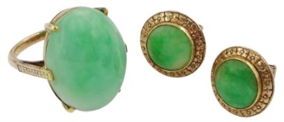Pair of gold circular jade stud earrings and a gold oval cabochon jade ring