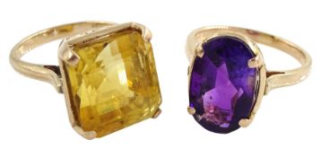 Gold single stone oval amethyst ring and a gold cushion cut citrine ring