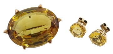 9ct gold large oval citrine brooch and a pair of 14ct gold circular citrine stud earrings