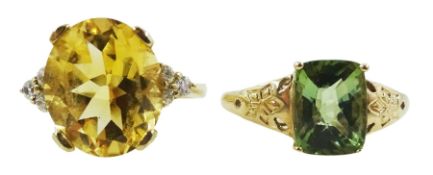 Gold oval citrine and cubic zirconia ring and a gold green stone set ring
