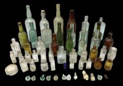 Collection of various vintage glass bottles and stoppers