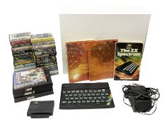 Sinclair ZX spectrum with basic programming guides and game cassettes