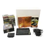 Sinclair ZX spectrum with basic programming guides and game cassettes