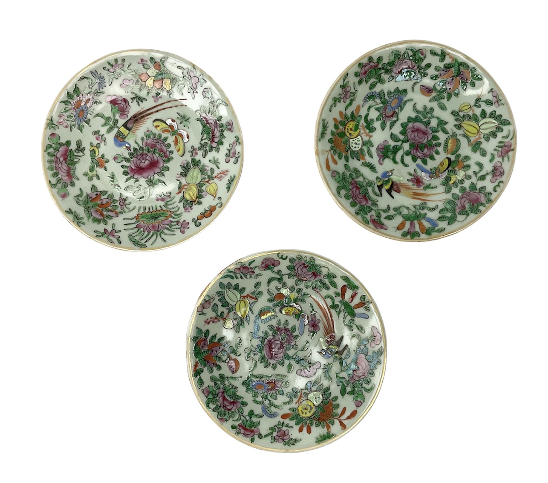 Three Chinese celadon plates decorated in the Famille Rose palette with enamelled birds