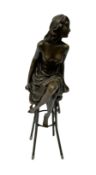 Art Deco style bronze modelled as a semi-nude lady seated on a stool