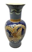 Oriental crackle glaze floor vase decorated with a dragon upon a blue ground