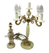 20th century gilt metal and onyx four branched candelabra upon a circular base