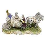 Capodimonte figure group of a horse drawn carriage with two horses pulling an open carriage with a m