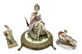 Capodimonte figurine of a lady seated upon a tree stump reading a book