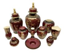 Two Crown Devon Rouge Royale pattern large temple jars with temple dog finial to lid