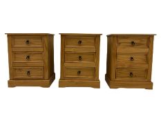 Pair of pine three drawer bedside chests