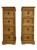 Pair of pine four drawer pedestal chests