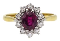 Gold oval ruby and diamond cluster ring