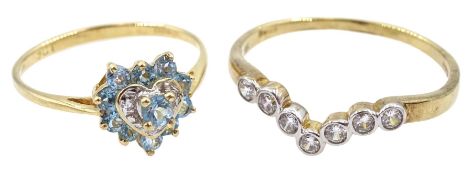 Gold blue topaz and diamond heart shaped ring and a seven stone cubic zirconia ring