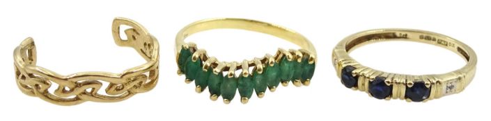 Gold eleven stone marquise cut emerald ring