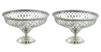 Pair of early 20th century small silver openwork footed bowls
