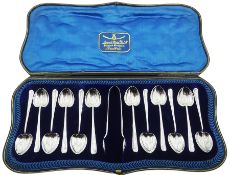 Late 19th/early 20th century set of twelve Arts & Crafts style silver rat tail coffee spoons with he