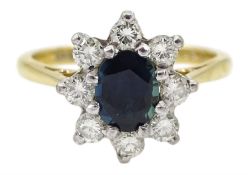 Gold oval sapphire and diamond cluster ring