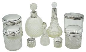Group of silver mounted cut glass dressing table jars and bottles