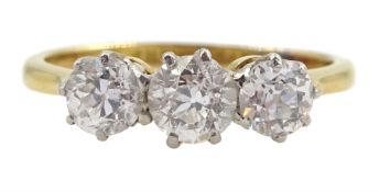 Gold three stone diamond ring
