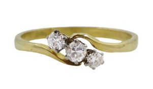 Gold three stone diamond crossover ring