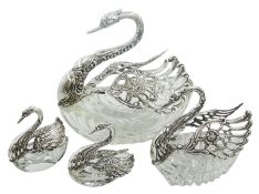 Four cut glass and silver mounted bonbon and salt dishes modelled as swans with pierced and articula