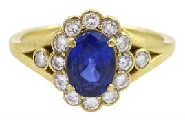 18ct gold oval cut sapphire and round brilliant cut diamond cluster ring