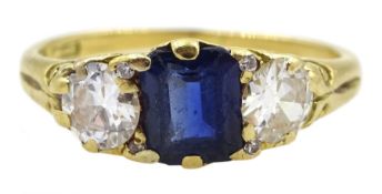 Early 20th century 18ct gold three stone emerald cut sapphire and old cut diamond ring