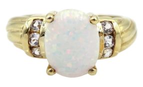 9ct gold single stone opal ring with white topaz set shoulders