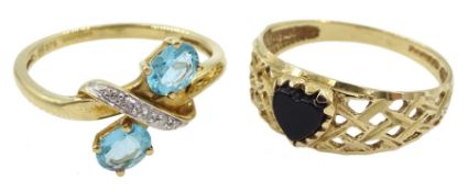 Gold topaz and diamond chip crossover ring and a gold black onyx heart shaped ring