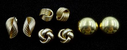 Two pairs of gold knot design stud earrings and two other pairs of gold stud earrings