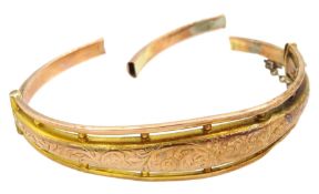 Early 20th century 9ct rose gold hollow bangle with engraved decoration