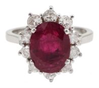 18ct white gold oval Thai ruby and round brilliant cut diamond cluster ring