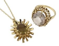 Gold single stone quartz ring with pierced design surround and gold smoky quartz pendant necklace