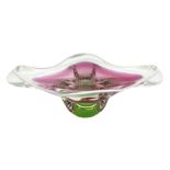 Art glass pink and green dish with white lined rim