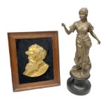 Framed cast brass head and shoulder plaque of Charles Dickens and a bronze painted spelter figure of