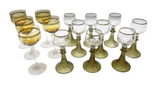 Set of nine German or Dutch Roemer glasses raised on olive coloured tapering spiral stem foot
