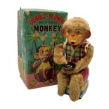 Battery operated bubble blowing monkey