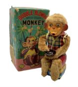 Battery operated bubble blowing monkey