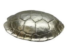 Composite wall hanging modelled as a silvered turtle shell