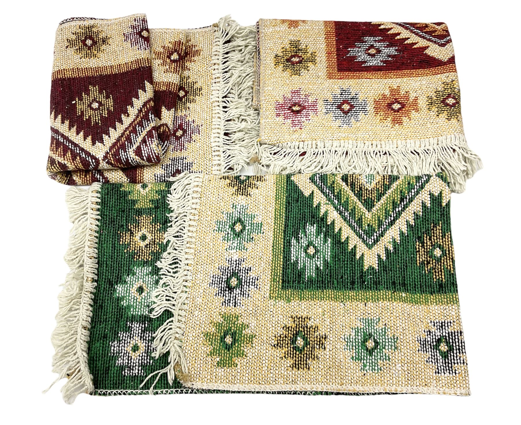 Three Turkish rugs decorated with geometric medallions and tasseled edges