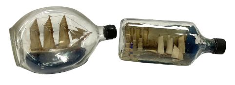 Two masted ships models in bottles