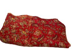 Embroidered bedspread with floral decoration on a red ground