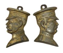 Two cast metal brassed wall mount plaques modelled as busts of Captain and soldier / lieutenant
