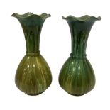 Pair of green glaze Bretby vases of bulbous form with a tulip necks