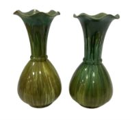 Pair of green glaze Bretby vases of bulbous form with a tulip necks