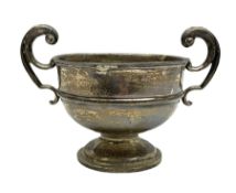 Silver James Deakin & Sons twin handled cup raised upon pedestal base